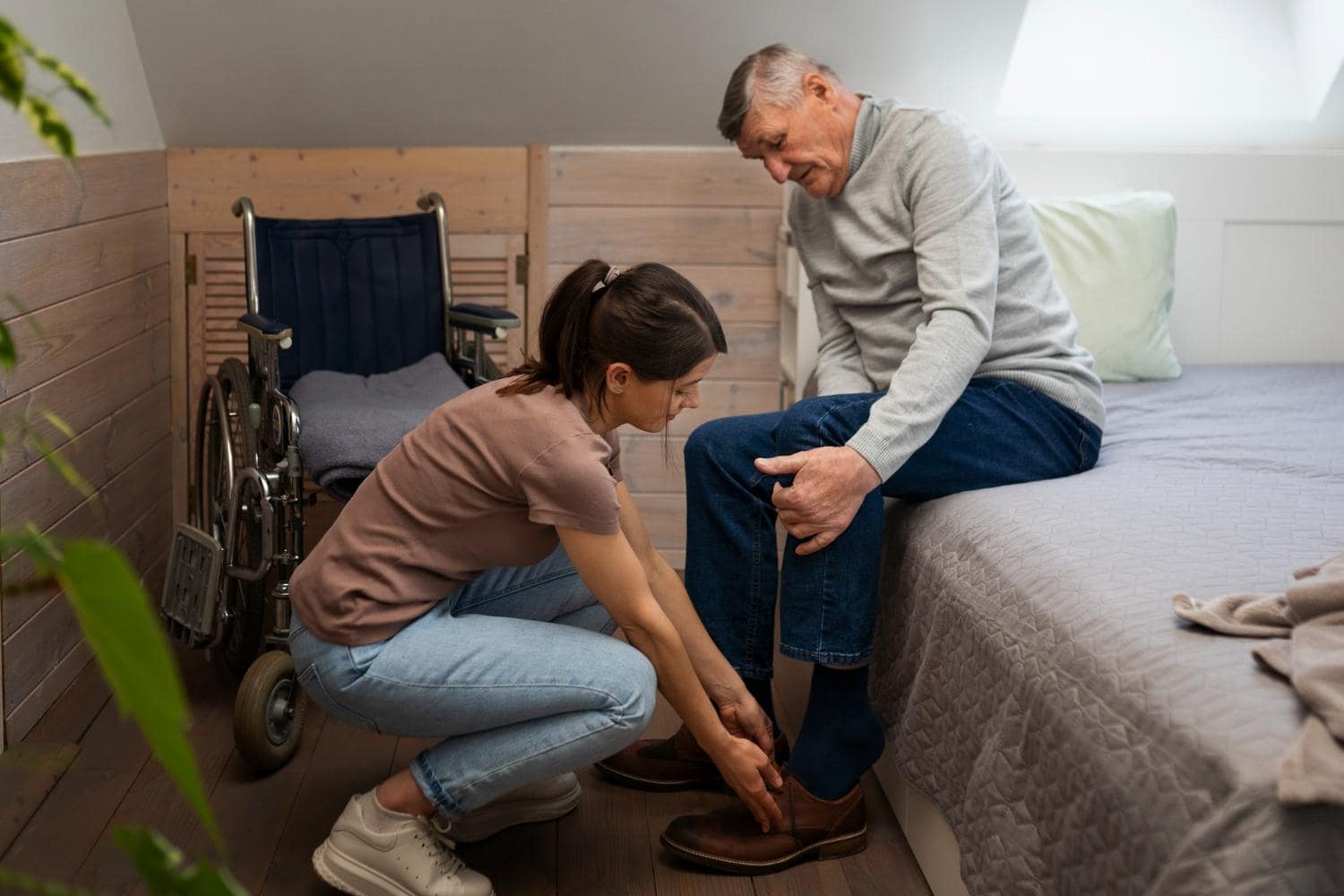 Female caretaker taking care of an elderly man