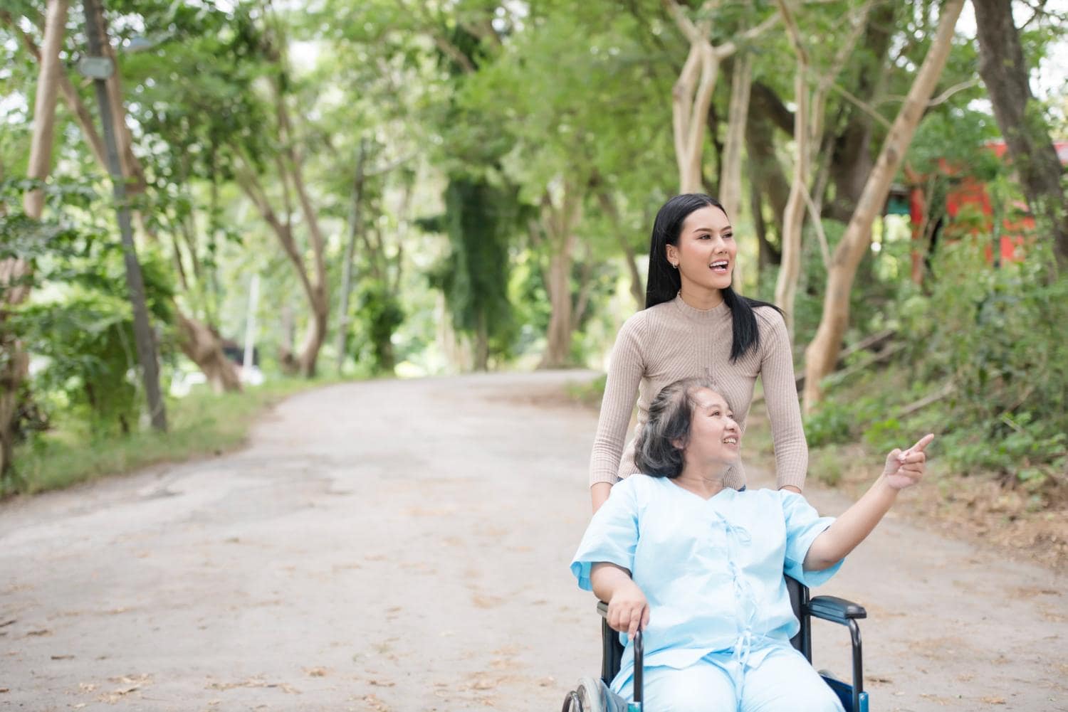 Daughter with her mother sitting in a wheelchair